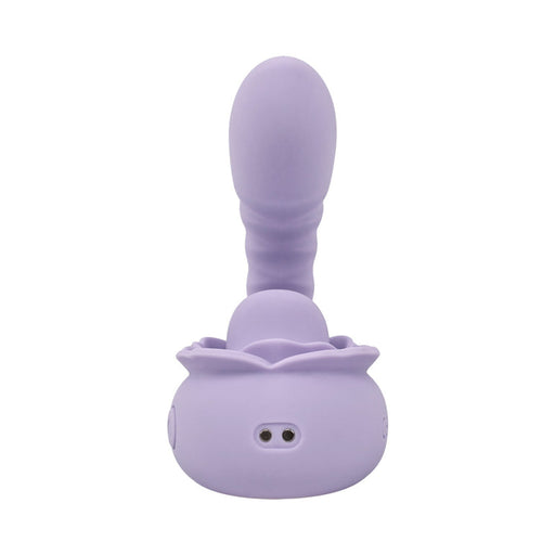 The Lilac Licks Clitoral & G-Spot Vibrator with Tongue Tease, shown upright against a white background, features a lavender silicone body, rounded ribbed shaft, and floral-shaped base.
