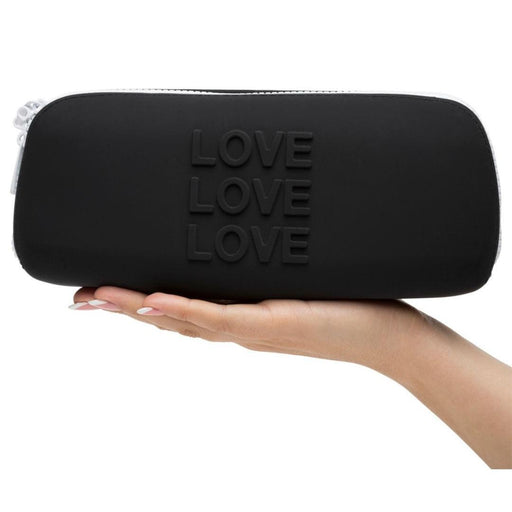 Happy Rabbit LOVE Medium Silicone Zipper Storage Case - Black held in a hand
