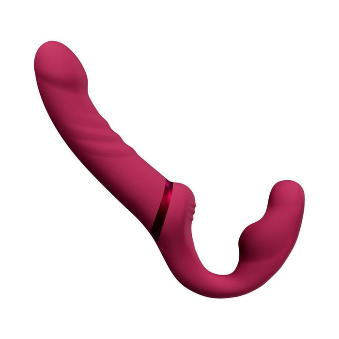 The Lovense Lapis App Controlled Strapless Strap-On Dildo by Lovense is a red, silicone double-ended sex toy with a sleek, curved design. One end is bulbous and rounded, while the other end is elongated with a slight curve. This waterproof toy features a smooth surface with subtle ridges and a thin red band near the middle.