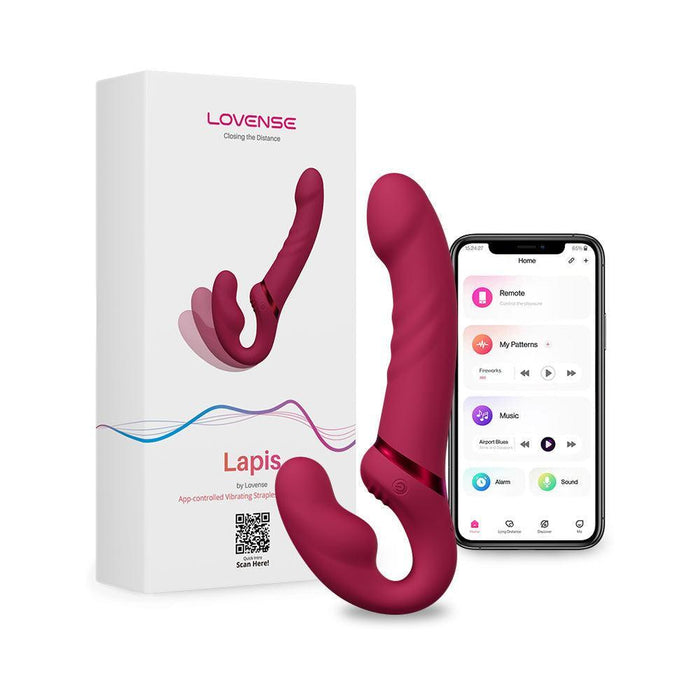 A Lovense Lapis App Controlled Strapless Strap-On Dildo set, featuring the dildo, its packaging, and a smartphone displaying the Lovense Remote and App interface. The app provides controls to customize vibration patterns and intensity. The dildo and its box are in red and white.