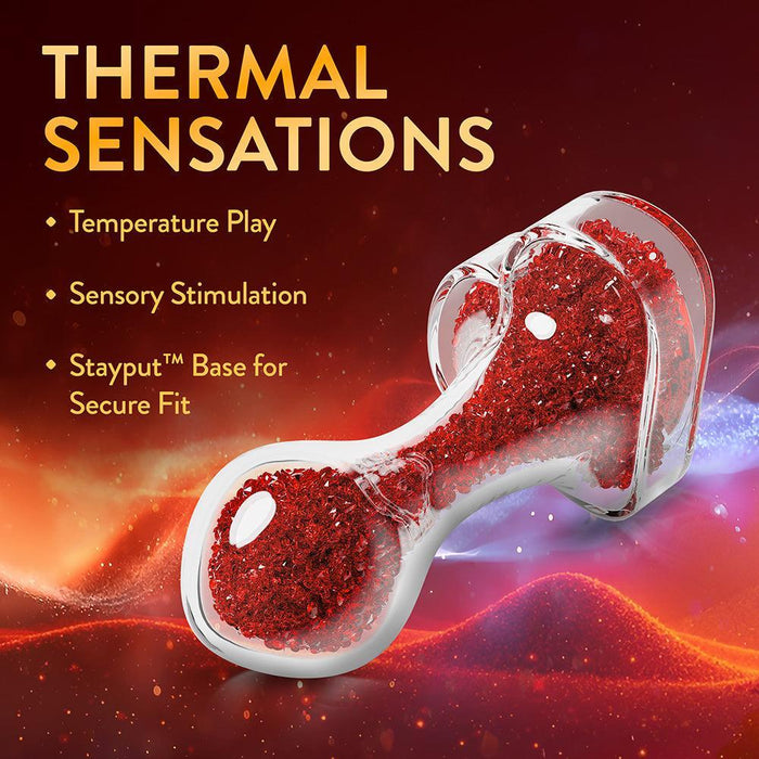 The Lustre Glass Butt Plug with Gem Base & Red Crystals sparkles with glittery ruby-red glass. Enjoy "Thermal Sensations," temperature play, and sensory stimulation, plus a secure Stayput heart-shaped base for peace of mind.