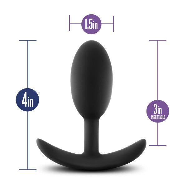 The Luxe Medium Wearable Silicone Vibra Slim Plug - Black by Blush features a black, curved base and measures 4 inches in total height. With an insertable length of 3 inches and a diameter of 1.5 inches at its widest point, all measurements are displayed around the plug in blue and purple text.