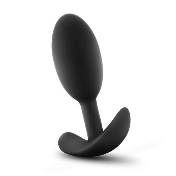 The Luxe Medium Wearable Silicone Vibra Slim Plug by Blush, in black, features a bulbous tip and an ergonomic base designed for easy handling. Its smooth surface and streamlined shape offer comfort and ease of insertion, while the flared base ensures safety and control during use, making it a premium choice.