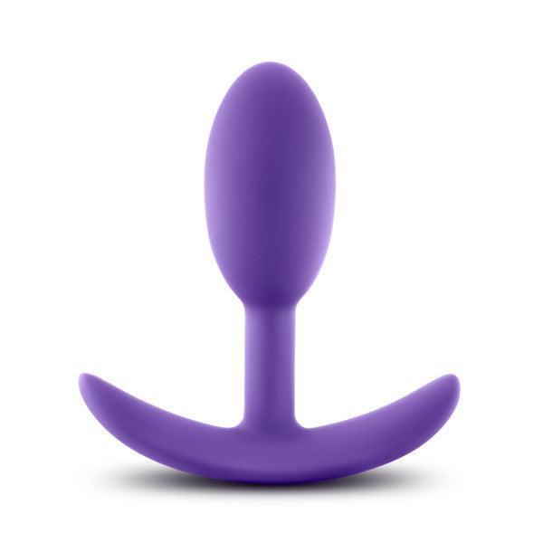 The Luxe Small Wearable Silicone Vibra Slim Plug - Purple by Blush is expertly crafted from hypoallergenic silicone. It boasts a smooth, bulbous tip and a curved base designed for comfort and safety. This sleek, seamless anal toy offers both style and peace of mind.