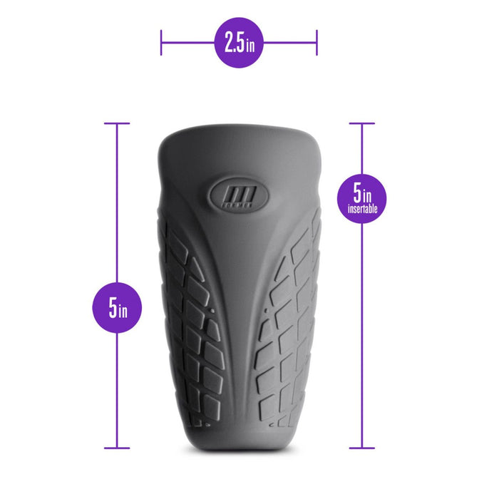 The M For Men Gript Discreet Silicone Penis Stroker by Blush is shown in a grey Platinum-Cured Silicone with texture zones. The top is slightly broader than the base and marked with measurements: 2.5 inches in diameter and 5 inches in height, including 5 inches of insertable length.