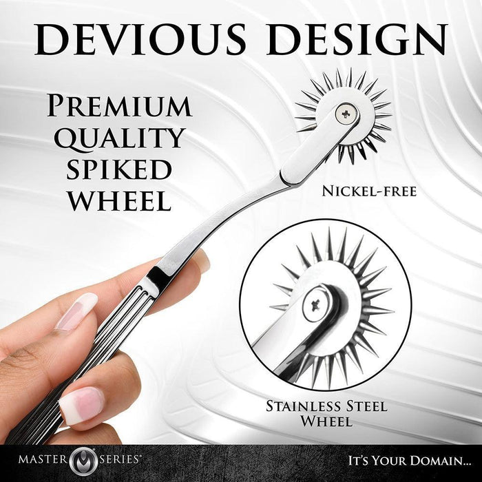 A close-up image of a hand holding a metal spiked wheel tool with the text: "DEVIOUS DESIGN - Premium Quality Nickel-Free Metal Wartenberg Wheel - Stainless Steel Wheel" against a textured, abstract white background. The brand name "XR Brands" is visible at the bottom along with the product name "Master Series Silver Sensation Wartenberg Wheel.