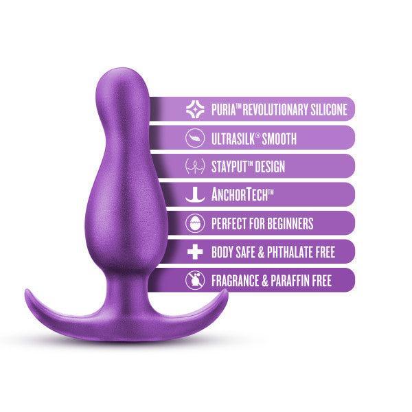 The Matrix First Time Flexible Silicone Butt Plug in Galactic Purple by Blush is presented alongside a list of features: Puria™ Revolutionary Silicone, Ultrasilk® Smooth, Stayput™ Design, AnchorTech™, Perfect for Beginners, Body Safe & Phthalate Free, Fragrance & Paraffin Free. Ideal for P spot stimulation.