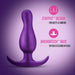 A Galactic Purple Matrix First Time Flexible Silicone Butt Plug by Blush is showcased centrally against a gradient purple background. The text on the right emphasizes its features with icons: "STAYPUT™ DESIGN for safety & comfort" and "ANCHORTECH™ BASE so plug is secured in place." Made from body-safe silicone.