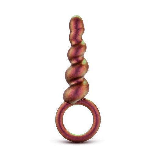 The Matrix First Time Soft Silicone Spiral Anal Beads with Finger Loop by Blush features a smooth, twisted design and a small circular loop at its base. Sporting a gradient color scheme that transitions between shades of red, gold, and green, this item is perfect for orgasmic anal play against a pristine white background.