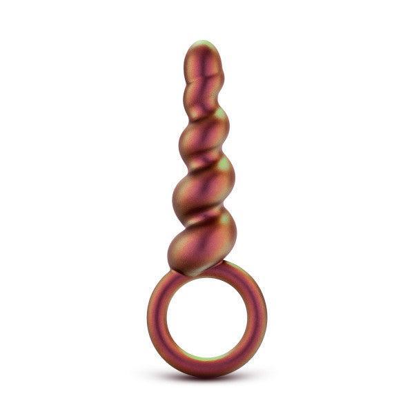 The Matrix First Time Soft Silicone Spiral Anal Beads with Finger Loop by Blush features a smooth, twisted design and a small circular loop at its base. Sporting a gradient color scheme that transitions between shades of red, gold, and green, this item is perfect for orgasmic anal play against a pristine white background.