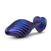 The Matrix Swirl Bling Butt Plug with Sparkly Heart Base by Blush is a silicone, iridescent blue and purple textured toy featuring a bulbous end and a heart-shaped base. It boasts a ribbed, spiral design and is showcased against a plain white background.