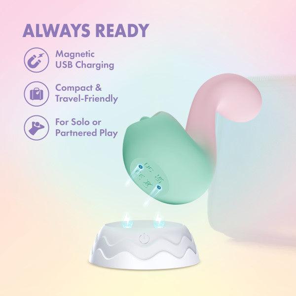 The Melody Double Ended Licking Tongue & G-Spot Vibrator in pastel green and pink floats above a white lit charging base. Features: "Magnetic USB Charging," "Body-Safe Silicone," and "Solo or Partnered Play.