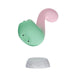 The Melody Double Ended Licking Tongue & G-Spot Vibrator, in pastel green and pink body-safe silicone with a curved design, hovers above its white round charging base against a plain white background.