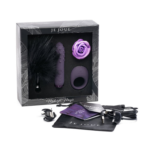 The Midnight Magic Couples' Sex Toy Gift Set by Je Joue includes a feather tickler, textured vibrator, vibrating cock ring, rose-shaped toy, charging cable, storage pouch, and instruction booklets arranged outside the box.