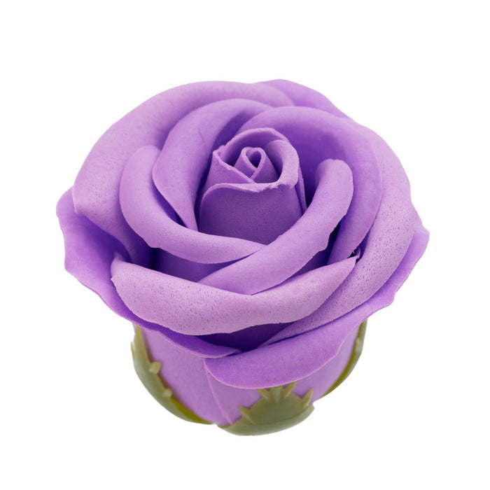 A close-up of a single artificial purple rose with green leaves, isolated on white—the perfect romantic touch to the Midnight Magic Couples' Sex Toy Gift Set.