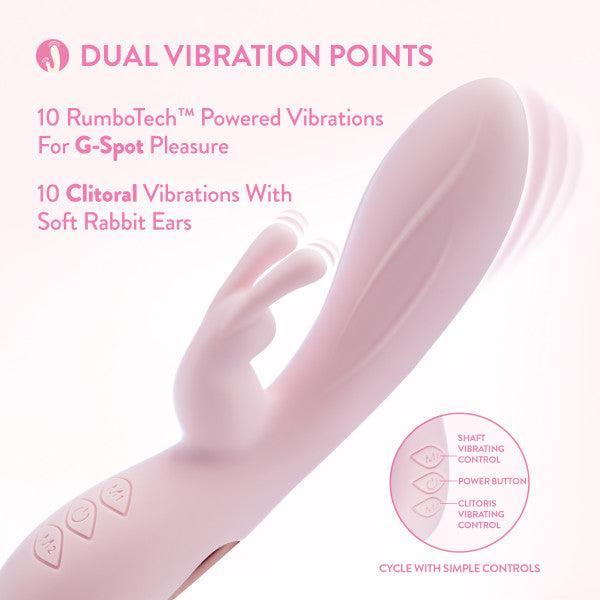 The Morgan Beginner G-Spot Rabbit Vibrator by Blush is displayed. This light pink vibrator features dual motors and soft bunny ears. Made from silky silicone, it offers 10 RumboTech-powered G-spot vibrations and 10 clitoral vibrations. The labeled controls allow for easy management of the vibration settings for both the shaft and clitoris, as well as power.
