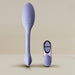 The Niya Rechargeable Kegel Exerciser and Vibrator with Remote, featuring a purple silicone textured oval head and long handle, is shown alongside its matching two-button wireless remote on a neutral background for pelvic floor strengthening.