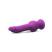 The New York Gyro Quake Thrusting 9.75 Inch Silicone Dildo - Purple by Blush, a phallic-shaped silicone plug in vibrant purple with a flared, ribbed base for safe use, is lying on its side against a white background. The toy features multiple vibrating modes for enhanced pleasure.