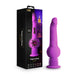 A purple vibrating toy with a detailed head and a ribbed, suction-based bottom. Made from smooth silicone, it boasts multiple vibrating modes and is waterproof. It stands next to its black and purple packaging featuring the New York City skyline, the product name "New York Gyro Quake Thrusting 9.75 Inch Silicone Dildo - Purple" by Blush, and icons indicating various features and specifications.