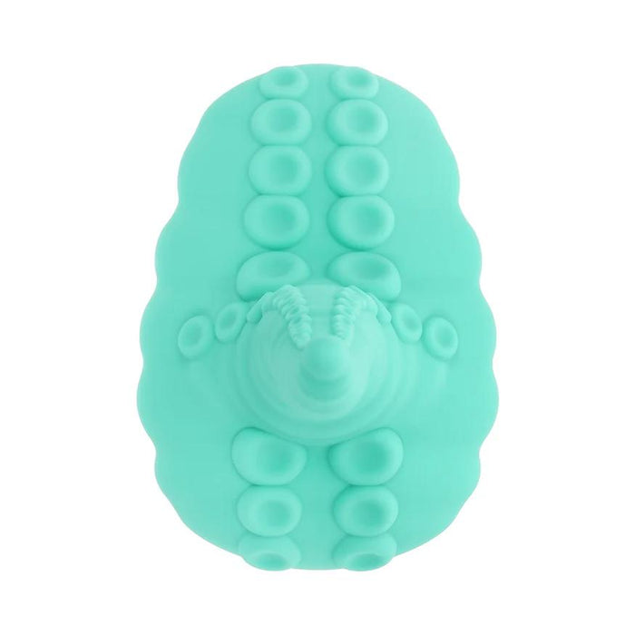 A teal Octopus Tentacle Insertable Remote Controlled Grinder, oval-shaped with raised circular bumps resembling suction cups, is shown from above on a white background.