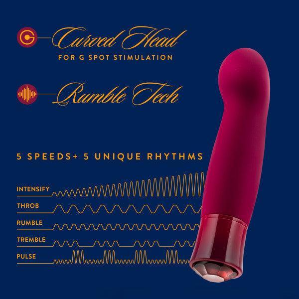 The Oh My Gem Classy Garnet Warming Internal & External Vibrator from Blush, showcased against a dark blue background, boasts a striking red design with a curved head dedicated to G-spot stimulation. Emblazoned with "Curved Head for G Spot Stimulation" and "Rumble Tech," this vibrator features five speeds paired with five unique rhythms—Intensity, Throb, Rumble, Tremble, and Pulse—designed to ignite your sexual passion.