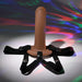 The Our First Hollow Strap-On Dildo + Harness Set - Chocolate features adjustable black straps and a flexible TPE shaft, showcased against swirling multicolored light patterns that accentuate its smooth texture, perfect for beginners.