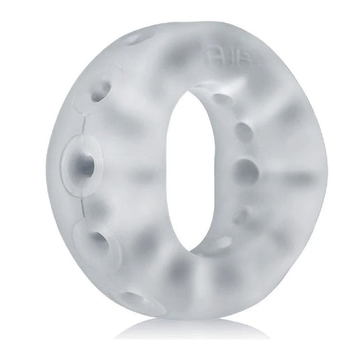 A transparent, gel-like ring made from a super-soft silicone blend features a series of small circular openings along its surface. The material appears soft and flexible, with a smooth texture and an overall frosted appearance, promising long-wear comfort. This describes the Oxballs Air Flow Light Stretchy Cock Ring - Clear by Oxballs.
