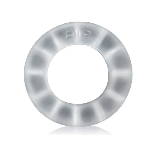 A translucent, circular Oxballs Air Flow Light Stretchy Cock Ring - Clear made from a super-soft silicone blend with the word "AIR" embossed at the top. The ring has a smooth and minimalist design, with a slightly frosted, semi-opaque appearance. It offers long-wear comfort and is placed against a white background, casting a subtle shadow beneath it.