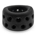 A black Oxballs Air Lite Ventilated Ball Stretcher - Black Ice, slightly resembling a thick bracelet, features numerous ventilation holes around its smooth matte surface. Made from a silicone TPR blend, the ball stretcher is placed against a plain white background.