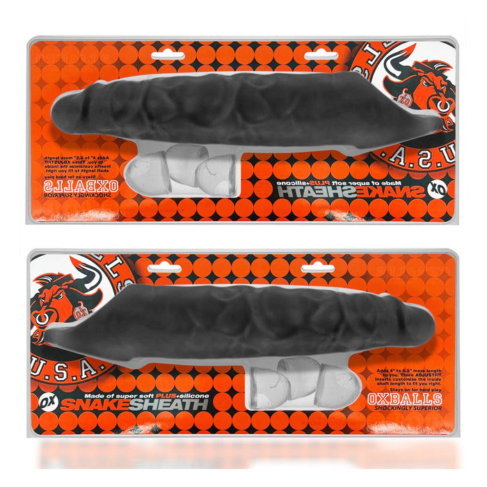 The image features two identical products, each packaged in an orange and black blister pack with a bull graphic and the name "Oxballs." The product, identified as the "Oxballs Snake Extra Long 11 Inch Cock Sheath with Ball Strap - Black," appears to be an ultra-long cock sheath with an adjustable fit and veiny texture.