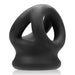 Representing a modern and artistic design, the Oxballs Tri Squeeze Cocksling Ball Stretcher - Black by Oxballs is a body-safe, matte black silicone accessory that features multiple openings and rounded edges, resembling a small, futuristic sculpture.