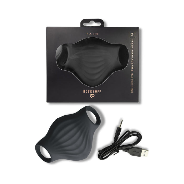 A black, contoured handheld masturbator made from body-safe silicone with two loop handles is shown beside its packaging and USB charging cable. The box is labeled "Palm Vibrating Versatile & Accessible Masturbator.