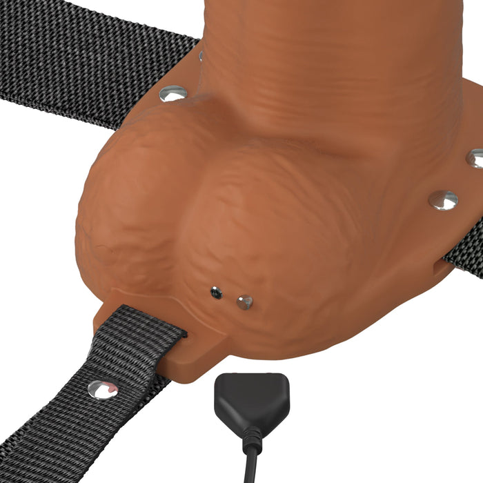 A close-up of the Fantasy X-Tensions Elite Vibrating Hollow 7 Inch Silicone Dildo & Strap-On Harness – Chocolate, featuring an adjustable harness designed for comfort and a secure fit.