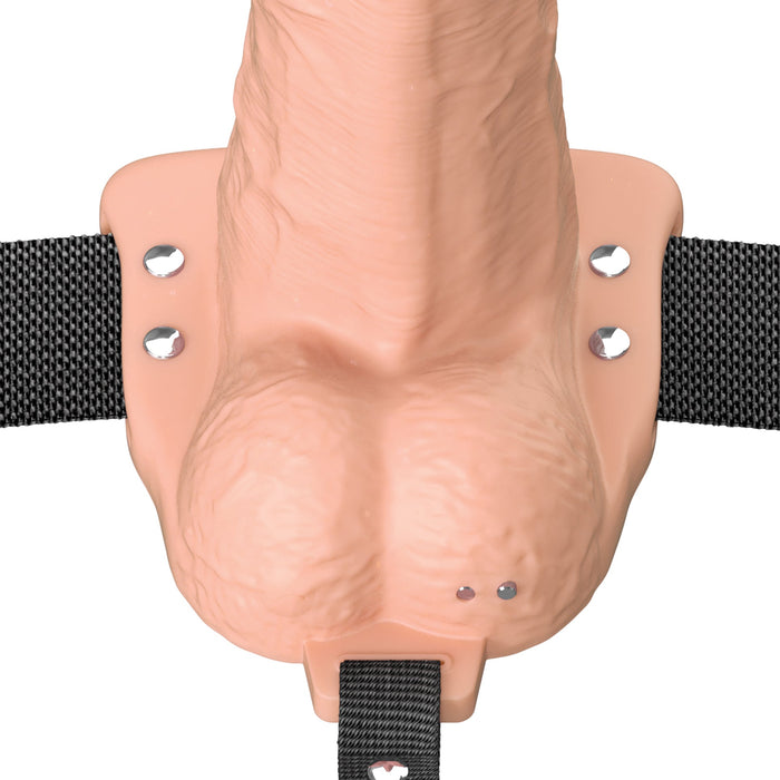 A close-up of the Fantasy X-Tensions Elite Vibrating Hollow 8 Inch Silicone Dildo & Strap-On Harness in Vanilla, highlighting its realistic details and lifelike texture.