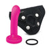 The Pop Strap On Dildo & Harness Set in Pink Silicone - 5 inches features a pink silicone dildo with a flared base next to a black harness with buckles, snap fasteners, and an O-ring, arranged on a white background. Ideal as a strap on option.