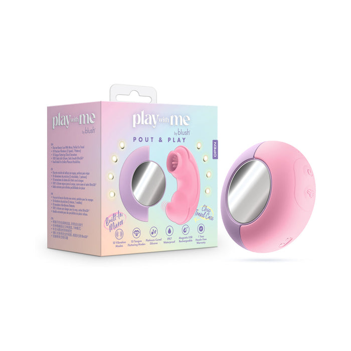 The pink and purple Pout & Play Double Ended Vibrator with Licking Tongue rests next to its pastel "Play With Me by Blush" box, which displays product images, icons, and descriptions.