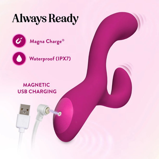 The Quinn Warming G-Spot Rabbit Vibrator, a pink, curved toy with a smaller extension, is made from body-safe silicone and offers waterproof design and magnetic USB charging. It’s shown with its charging cable on a light pink background.