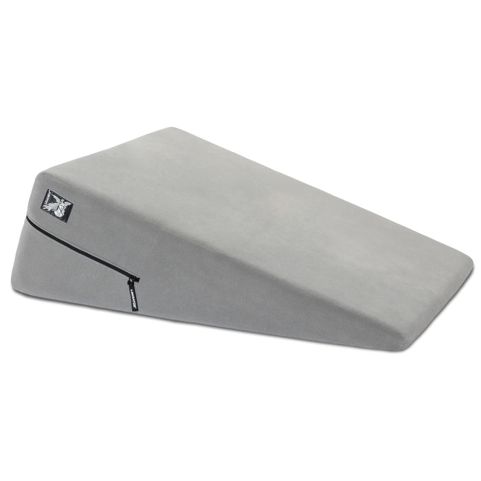 The Liberator Ramp – Intimate Positioning Support Cushion 24 Inches is a gray foam wedge pillow with a zippered, removable cover, designed for comfort and support, ideal as a sex position pillow for deeper penetration.