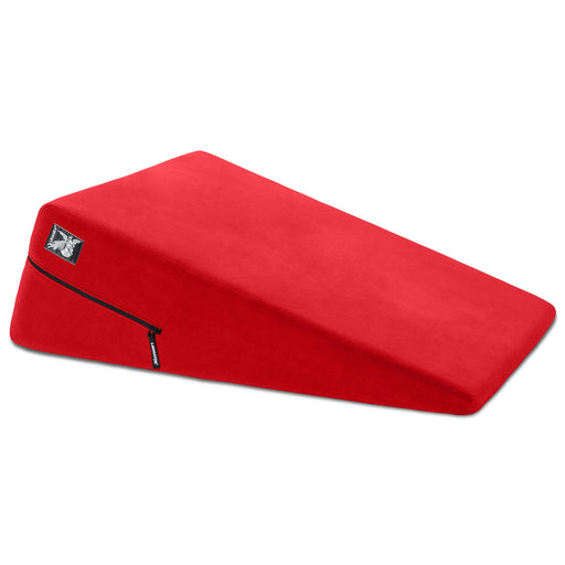 The Liberator Ramp – Intimate Positioning Support Cushion 24 Inches is a bright red, wedge-shaped foam pillow with a zippered cover for comfort and support—perfect as a sex position pillow to enhance deeper penetration. Shown on a white background.