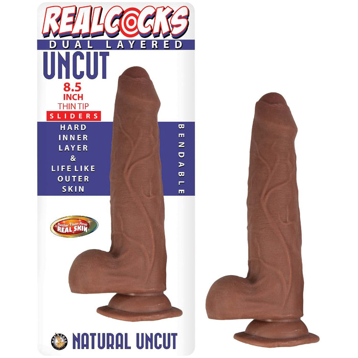 Image of a product called "Realcocks Uncut 8.5" Slider Dildo with Thin Tip & Sliding Skin - Chocolate." The packaging features an 8.5-inch, life-like, bendable, natural uncut brown phallic object with a hard inner layer and realistic outer skin. This sliding skin dildo by Nasstoys includes a strong suction cup base and dual density core.