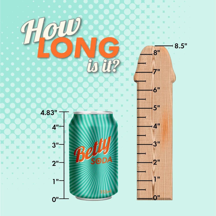 A promotional image features a can of "Betty Soda" next to a Nasstoys Realcocks Uncut 8.5" Slider Dildo with Thin Tip & Sliding Skin - Chocolate. The can's height is labeled 4.83", and the dildo, resembling a realistic phallic-shaped ruler with measurements up to 8.5", has text at the top reading "How LONG is it?" against a polka dot background.
