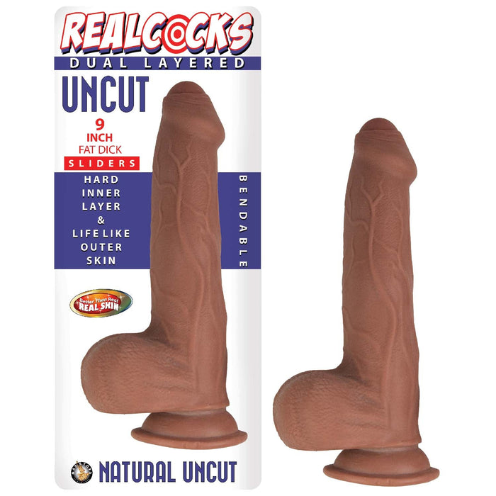 The image shows the packaging and product of the Nasstoys brand. The Realcocks Uncut 9" Fat Dick Slider Dildo with Sliding Skin - Chocolate is a dual-layered, 9-inch, uncut, bendable dildo with a hard inner layer and lifelike outer skin. Featuring a strong suction cup base, the box highlights its natural uncut design, realistic texture, and bendability.