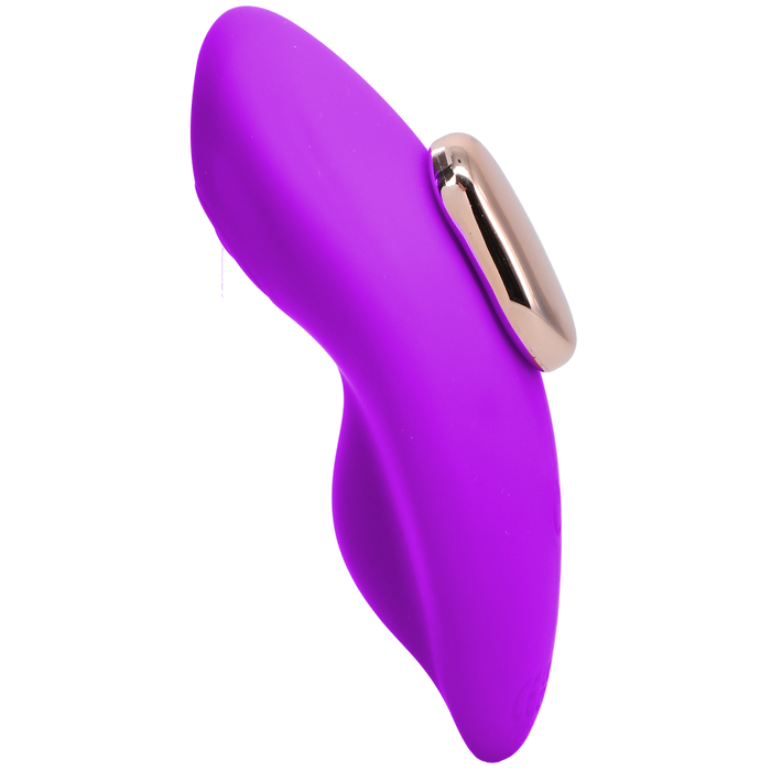 Introducing the Remote Controlled Panty Vibrator for Beginners in a Bag by Doc Johnson. This purple ergonomic personal massager boasts a sleek, curved design with a metallic silver accent on the side. It features smooth surfaces and a form-fitting shape for precise stimulation, crafted from eco-friendly materials. Additionally, it includes a wireless remote control for ultimate convenience.