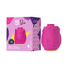 The Romp Rose 2 Pleasure Air Clitoris Stimulator, shaped like a pink rose, is shown beside its vibrant box labeled "ROMP Rose" and featuring the slogan "FALL IN LUST" for enhanced clitoral stimulation.