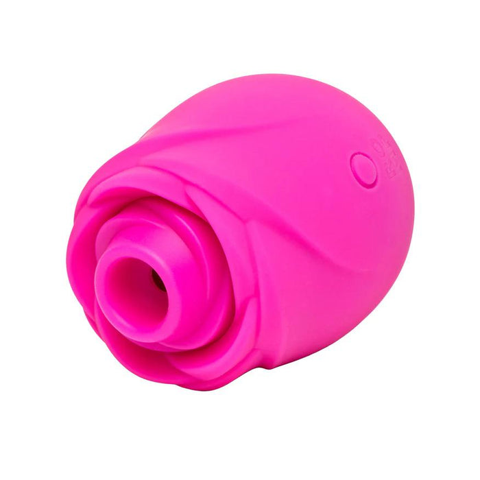 The Romp Rose 2 Pleasure Air Clitoris Stimulator is a pink, rose-shaped silicone device with a central circular opening, specially designed for clitoral stimulation and personal massage.