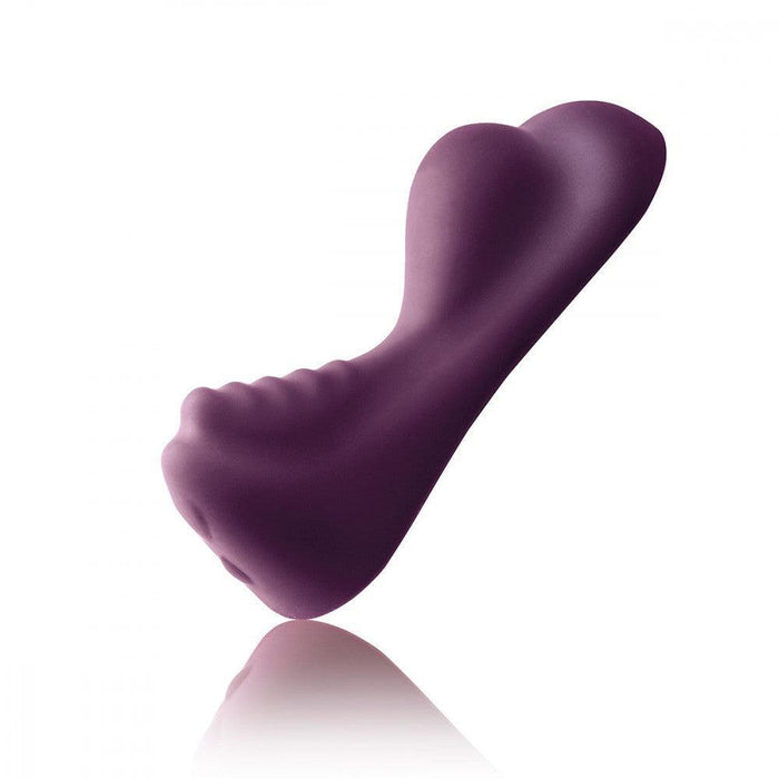 A purple, ergonomically shaped personal massager with a smooth surface and contoured design, shown on a white background. The Ruby Glow Ride On External Hands-Free Humping Vibrator by Rocks Off features curves and a form tailored for comfort and ease of use. This non-penetrative vibe promises a uniquely satisfying experience.