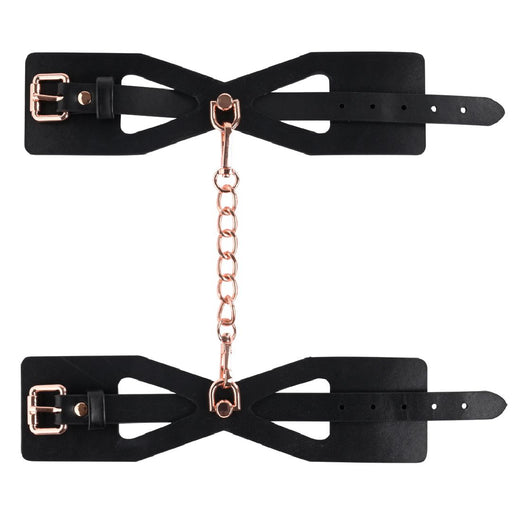 Sex And Mischief Brat Handcuffs linked with chain on white background 