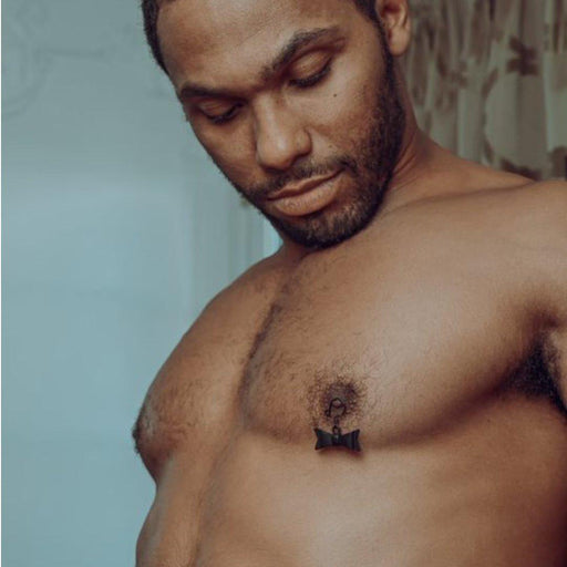 Sincerely Bow Tie Nipple Jewelry on man's nipples