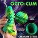 A hand holds the Siphon Green Tentacle Squirting Penis Enhancer, shaped like a colorful tentacle. Insets show its textured, stimulating design. The purple background features the "Creature Cocks" brand at the bottom.