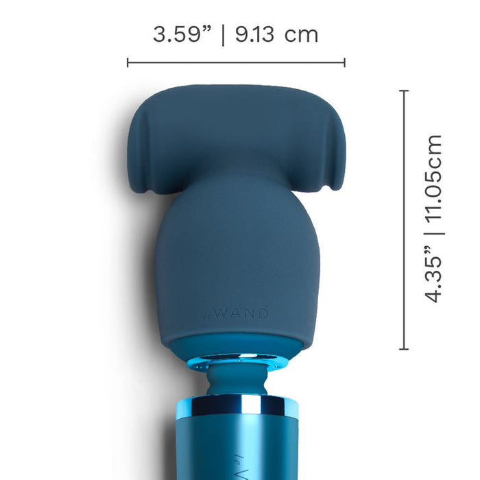 The Stroke Silicone Penis Play Wand Attachment is blue, measures 3.59 inches (9.13 cm) wide and 4.35 inches (11.05 cm) tall, and features a rounded, textured silicone head for enhanced sensation during use.
